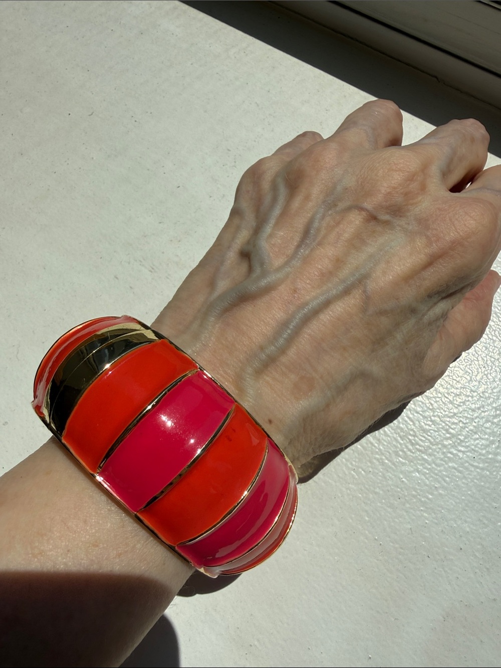 Vibrant Pink & Orange Hinged Enamel Bangle Bracelet with Gold Accents.